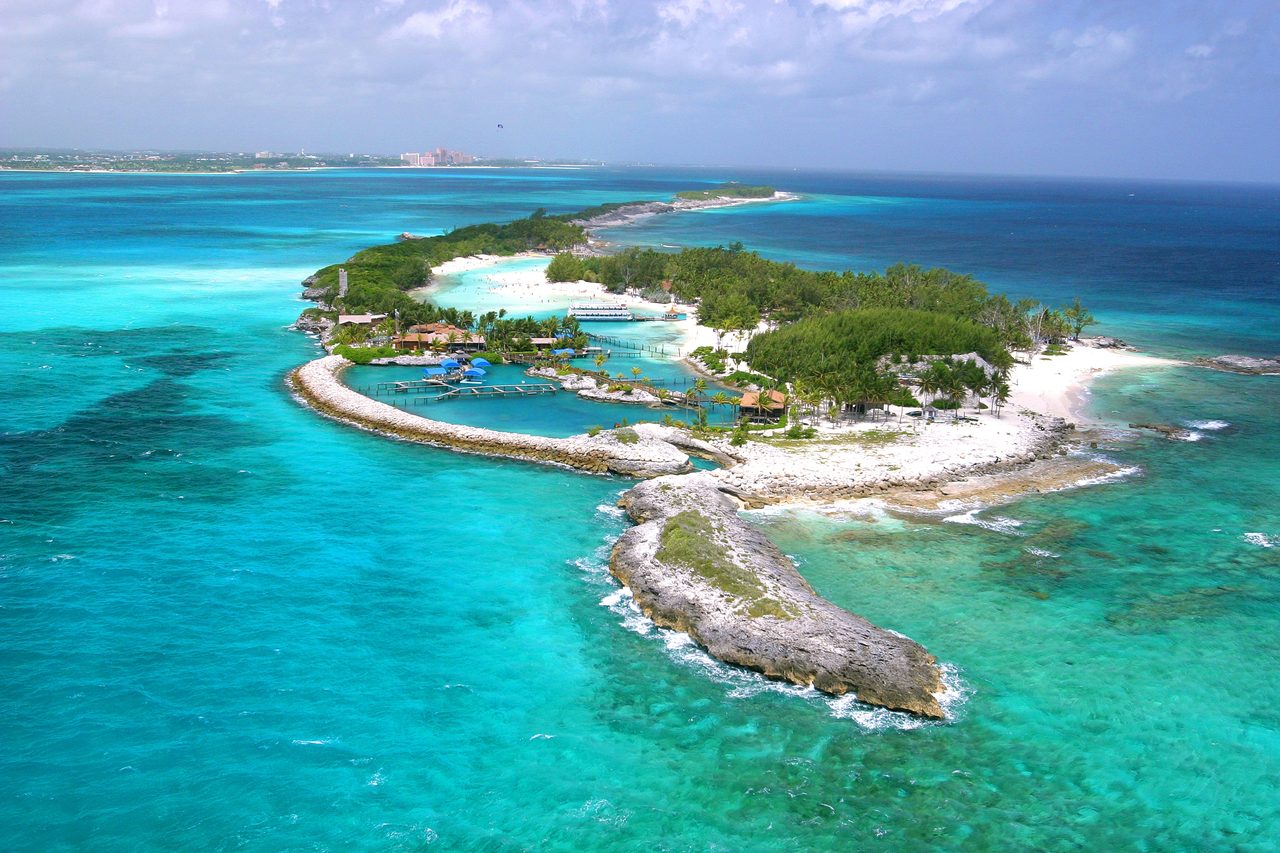 Turquoise shallow water and white sandbars between small islands in the Exumas