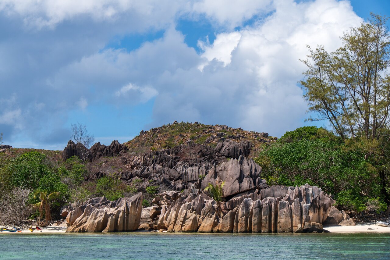 Smooth granite boulders and calm turquoise water at Anse Source d'Argent on La Digue